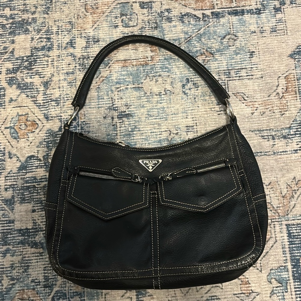 PRADA
Vitello Front Pockets Leather Shoulder Bag
